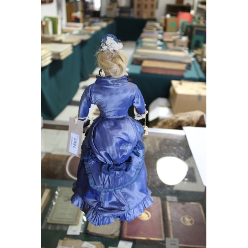 1507 - 19THC FRENCH FASHION DOLL a long faced French bisque head doll with swivel neck, with pale blue ring... 