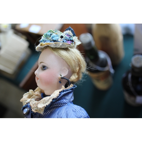 1507 - 19THC FRENCH FASHION DOLL a long faced French bisque head doll with swivel neck, with pale blue ring... 