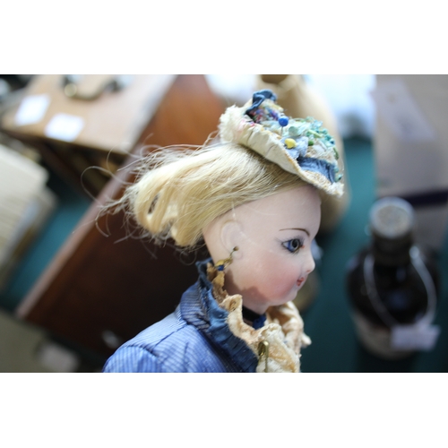 1507 - 19THC FRENCH FASHION DOLL a long faced French bisque head doll with swivel neck, with pale blue ring... 