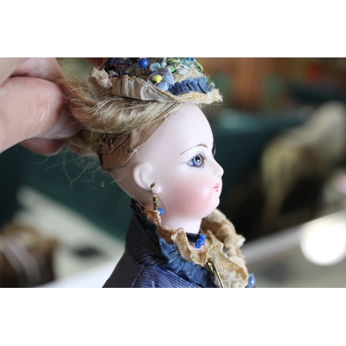 1507 - 19THC FRENCH FASHION DOLL a long faced French bisque head doll with swivel neck, with pale blue ring... 