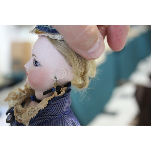 1507 - 19THC FRENCH FASHION DOLL a long faced French bisque head doll with swivel neck, with pale blue ring... 