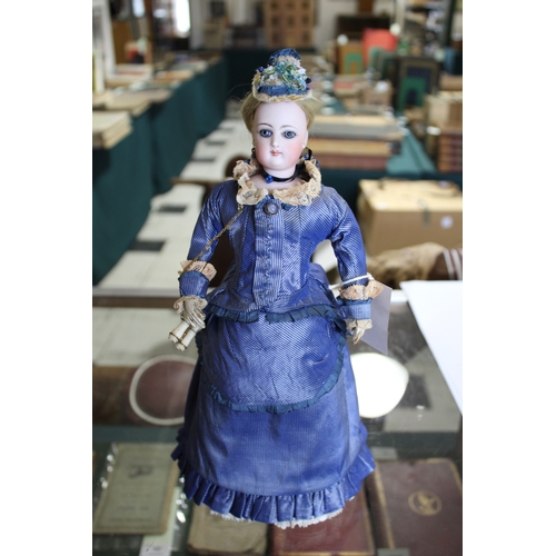 1507 - 19THC FRENCH FASHION DOLL a long faced French bisque head doll with swivel neck, with pale blue ring... 