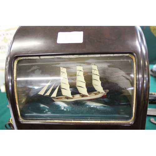 1563 - VITASCOPE BAKELITE SHIP CLOCK a Vitascope brown bakelite mantle clock, with an automated Ship (in wo... 