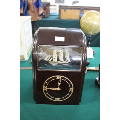 1563 - VITASCOPE BAKELITE SHIP CLOCK a Vitascope brown bakelite mantle clock, with an automated Ship (in wo... 