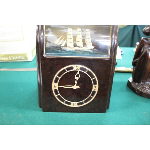 1563 - VITASCOPE BAKELITE SHIP CLOCK a Vitascope brown bakelite mantle clock, with an automated Ship (in wo... 