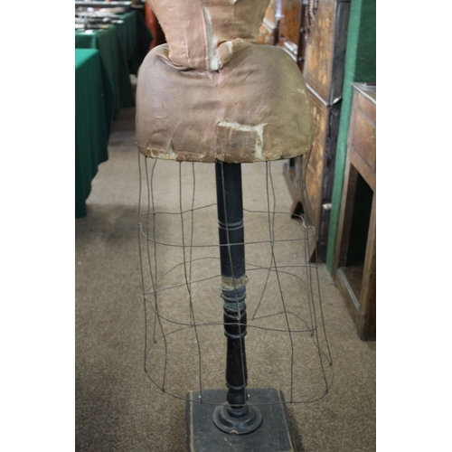 1801 - VINTAGE TAILORS DUMMY a wasp waist skirted tailors dummy or mannequin, mounted on a wooden stand and... 