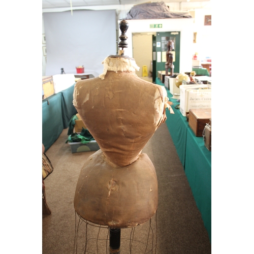 1801 - VINTAGE TAILORS DUMMY a wasp waist skirted tailors dummy or mannequin, mounted on a wooden stand and... 