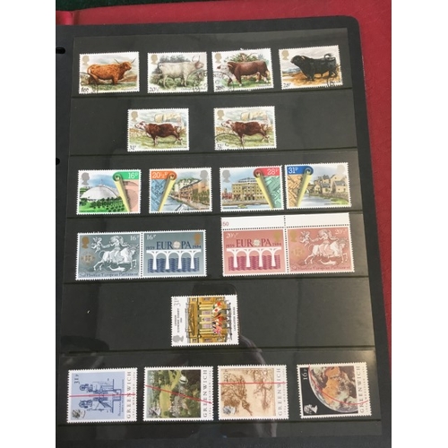 1300 - GREAT BRITAIN STAMP ALBUMS including an album with QE 11 mint and used examples (including £1 stamps... 