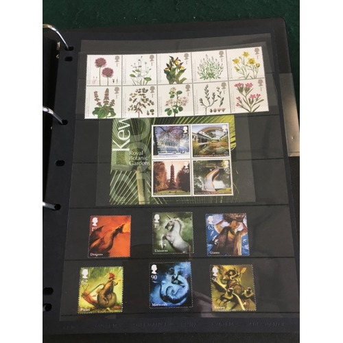 1300 - GREAT BRITAIN STAMP ALBUMS including an album with QE 11 mint and used examples (including £1 stamps... 