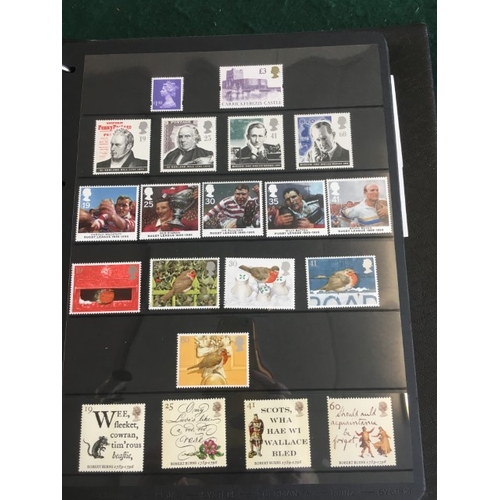 1300 - GREAT BRITAIN STAMP ALBUMS including an album with QE 11 mint and used examples (including £1 stamps... 