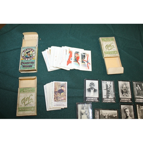 1330 - CIGARETTE CARDS in albums and in packets, including John Player Cricketers Caricatures, John Players... 