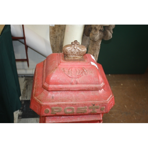 1565 - CAST IRON POST BOX a red painted cast iron pillar post box mounted with a crown to the top, marked P... 