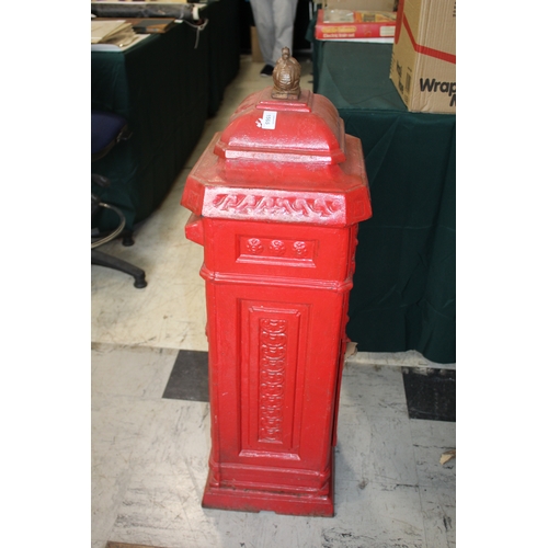 1565 - CAST IRON POST BOX a red painted cast iron pillar post box mounted with a crown to the top, marked P... 