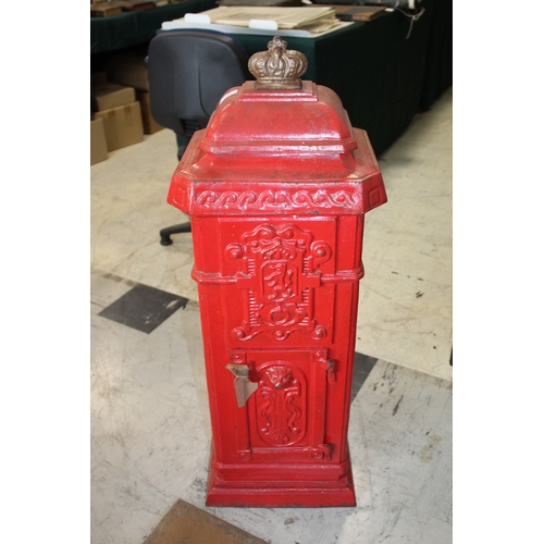 1565 - CAST IRON POST BOX a red painted cast iron pillar post box mounted with a crown to the top, marked P... 