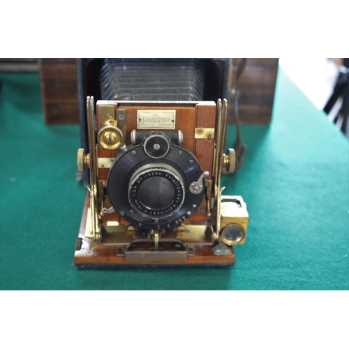 1548 - SANDERSON PLATE CAMERA a small mahogany and leather clad plate camera, with a Voigtlander Kollinear ... 