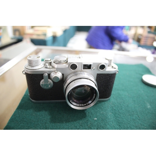 1681 - LEICA CASED CAMERA a Leica IIIf rangefinder camera, Serial Number 687691 (1954) and with a Leitz Sum... 