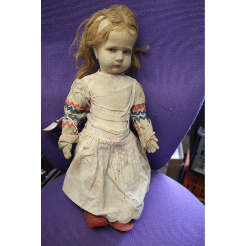 1477 - ANTIQUE DOLLS possibly by Kathe Kruse, including a large doll with a check coloured outfit and pair ... 