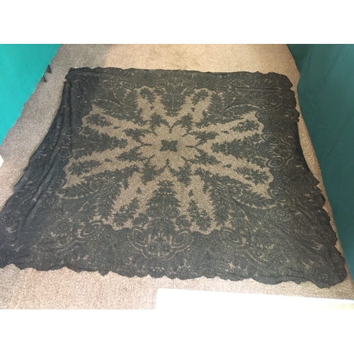 1781 - 19THC BLACK LACE SHAWL a 19thc shawl with a floral design, 180cms by 180cms.