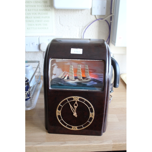 1563 - VITASCOPE BAKELITE SHIP CLOCK a Vitascope brown bakelite mantle clock, with an automated Ship (in wo... 