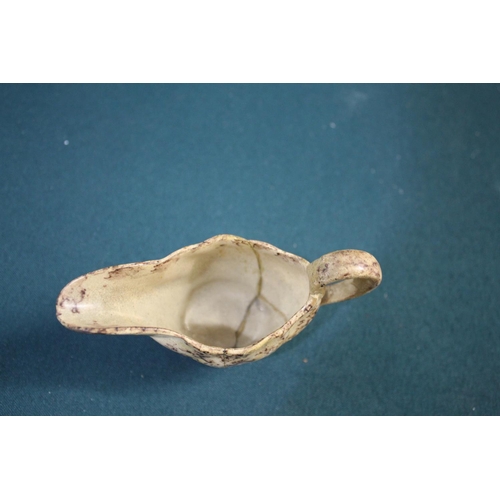 1368A - WHIELDON STYLE CREAMWARE BUTTER BOAT late 18th century, with brown sponged decoration, length 12cm; ... 