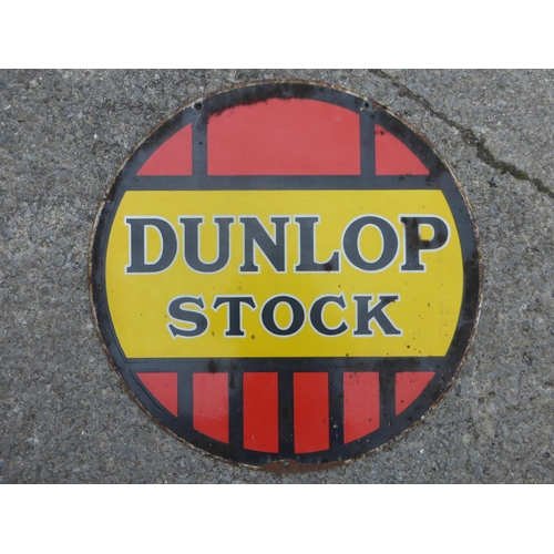 668 - Dunlop Stock.  A three-colour double-sided circular enamel sign, a little chipping to the edges, in ... 