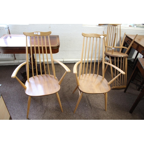 1007 - ERCOL DINING CHAIRS a set of four vintage light elm and beech stick back chairs (two carvers and two... 