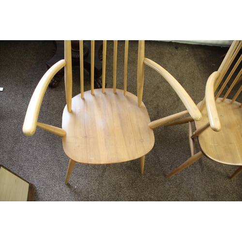 1007 - ERCOL DINING CHAIRS a set of four vintage light elm and beech stick back chairs (two carvers and two... 