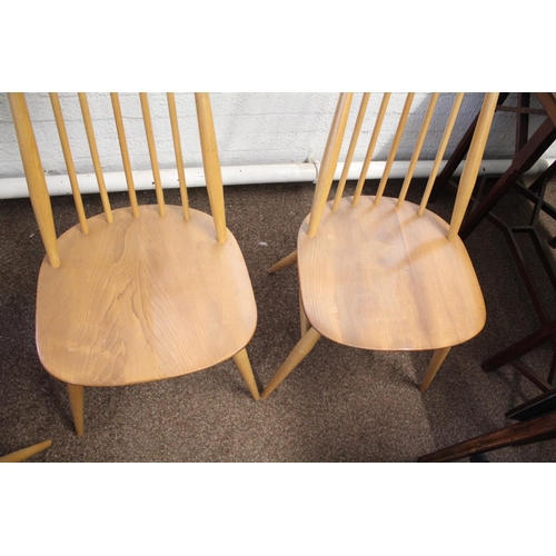 1007 - ERCOL DINING CHAIRS a set of four vintage light elm and beech stick back chairs (two carvers and two... 