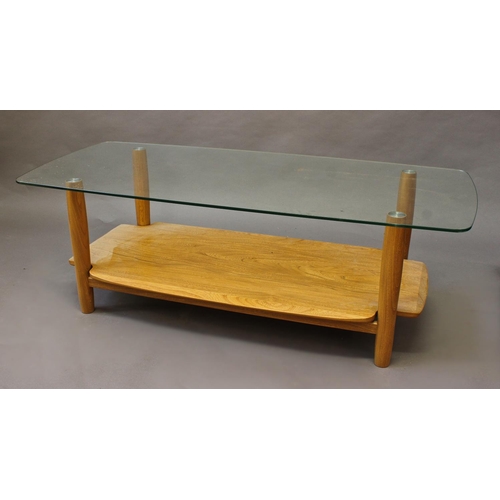 1008 - MODERN ERCOL COFFEE TABLE an unusual coffee table with a light elm shelf, with tapering legs support... 