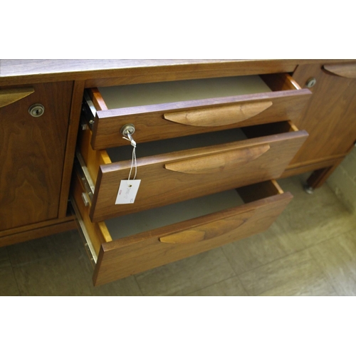 1015 - JENS RISOM MID CENTURY SIDEBOARD - DANISH a teak sideboard with three central drawers flanked by two... 