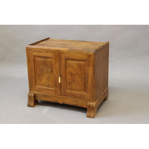 1017 - COTSWOLD SCHOOL CABINET the base of a Cotswold School cabinet, made in walnut with panel doors and l... 