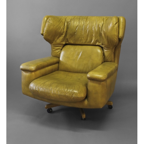 1018 - RETRO LEATHER SWIVEL CHAIR circa 1970's, a lime green leather chair of generous proportions and supp... 