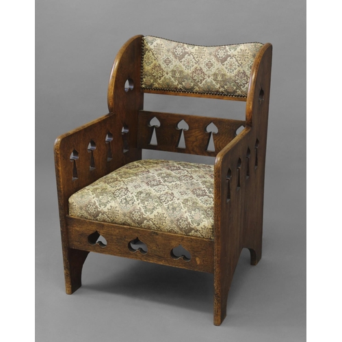 1020 - ARTS & CRAFTS ARMCHAIR - GOODYERS circa 1900, the oak armchair with heart and club motifs to each si... 