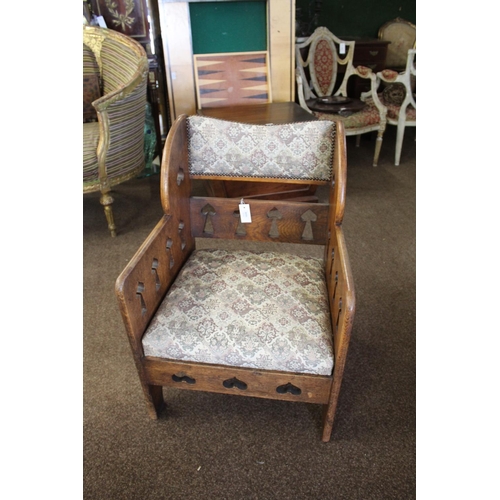 1020 - ARTS & CRAFTS ARMCHAIR - GOODYERS circa 1900, the oak armchair with heart and club motifs to each si... 