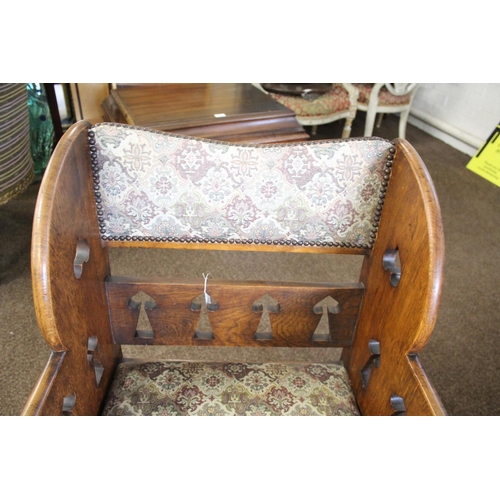 1020 - ARTS & CRAFTS ARMCHAIR - GOODYERS circa 1900, the oak armchair with heart and club motifs to each si... 