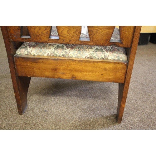 1020 - ARTS & CRAFTS ARMCHAIR - GOODYERS circa 1900, the oak armchair with heart and club motifs to each si... 