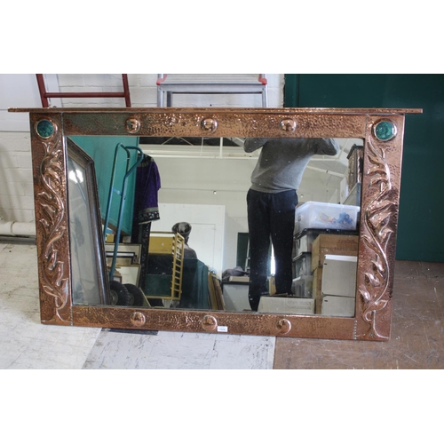 1024 - LARGE ARTS & CRAFTS COPPER MIRROR hand beaten and of rectangular shape with a top rail, inset with t... 