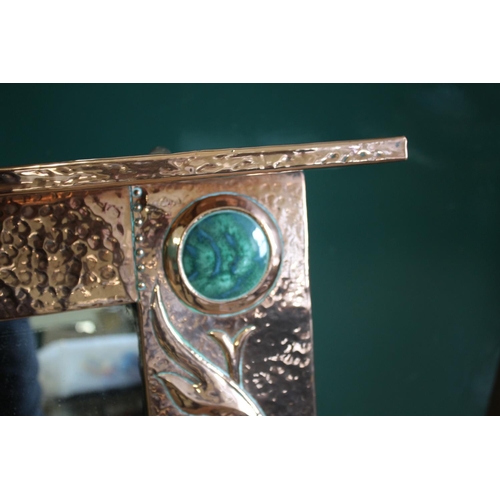 1024 - LARGE ARTS & CRAFTS COPPER MIRROR hand beaten and of rectangular shape with a top rail, inset with t... 