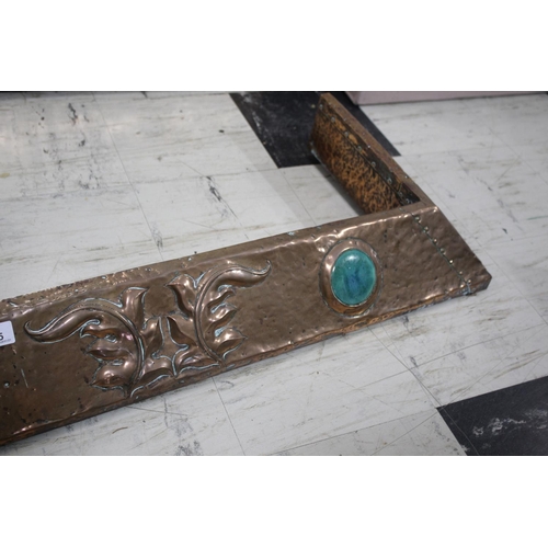 1025 - ARTS & CRAFTS COPPER FENDER a hand beaten fender with exposed rivets, with three Ruskin style rounde... 