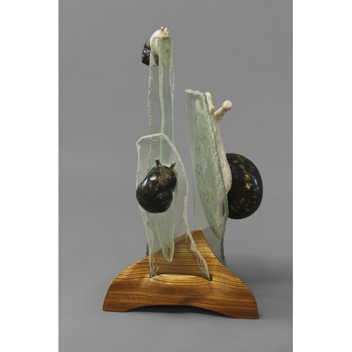 1032 - CONTEMPORARY MARBLE & GLASS SCULPTURE - SNAILS an interesting group of three marble snails, each mou... 