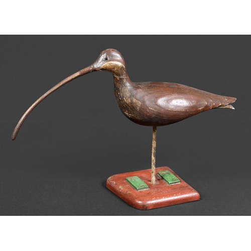 1034 - GUY TAPLIN - CARVED WOODEN CURLEW a large painted wooden model of a Curlew, supported by a metal sha... 