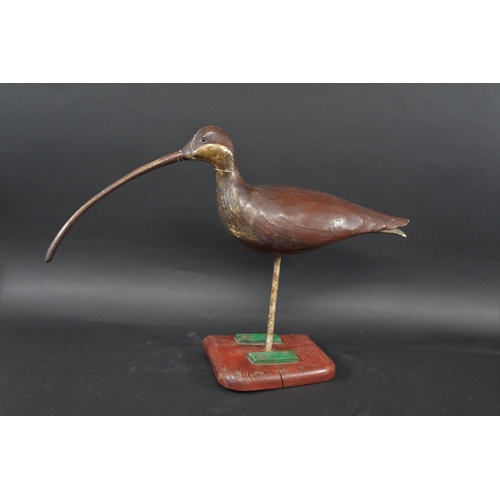 1034 - GUY TAPLIN - CARVED WOODEN CURLEW a large painted wooden model of a Curlew, supported by a metal sha... 