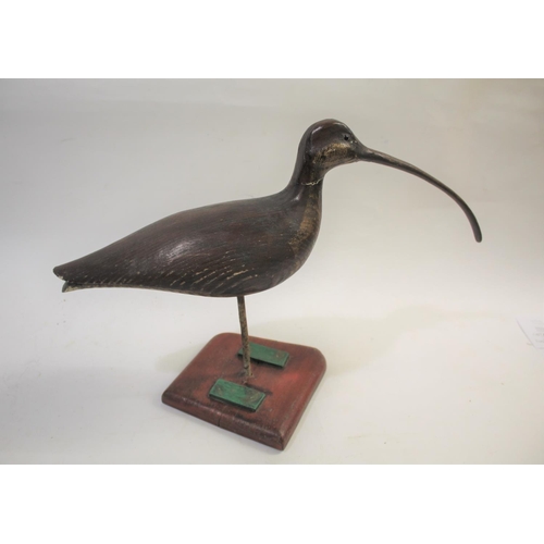 1034 - GUY TAPLIN - CARVED WOODEN CURLEW a large painted wooden model of a Curlew, supported by a metal sha... 