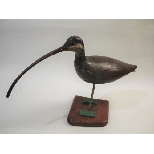 1034 - GUY TAPLIN - CARVED WOODEN CURLEW a large painted wooden model of a Curlew, supported by a metal sha... 