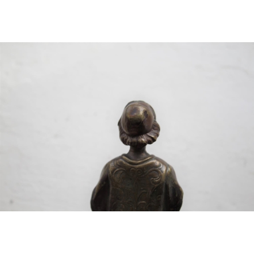 1038 - FRIEDRICH GOLDSCHEIDER BRONZE a small bronze figure of a boy in a Court uniform, and holding a book ... 