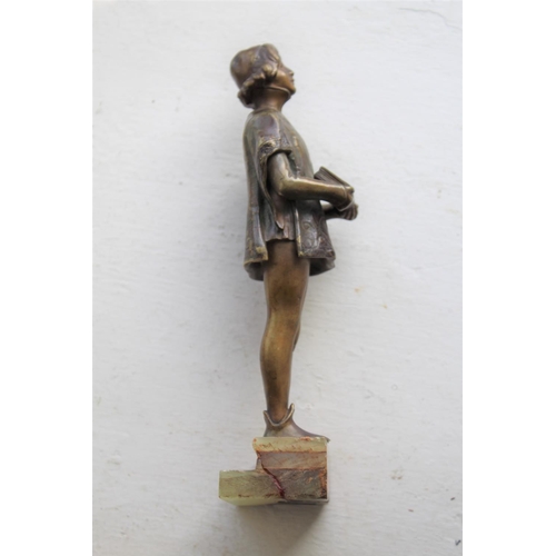 1038 - FRIEDRICH GOLDSCHEIDER BRONZE a small bronze figure of a boy in a Court uniform, and holding a book ... 