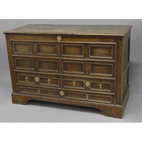 1710 - AN EARLY 18TH CENTURY MULE CHEST, with a broad rectangular top above a front with eight recessed rec... 