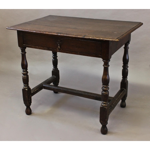 1718 - AN 18th CENTURY OAK SIDE TABLE, with a three plank top with moulded edge above a single frieze drawe... 