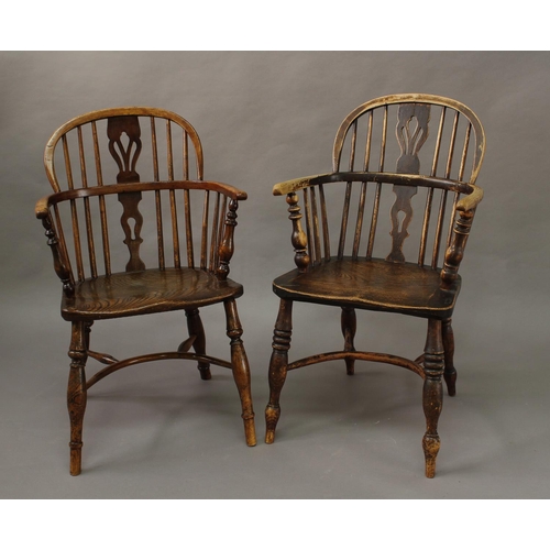 1720 - A NEAR PAIR OF 19TH CENTURY BEECH AND ELM WINDSOR ARM CHAIRS, each with low arched backs with simila... 