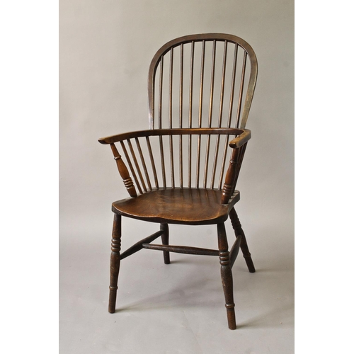 1722 - A 19TH CENTURY HIGH BACKED WINDSOR ARMCHAIR, beech, ash and elm with a tall hooped back and broad ar... 